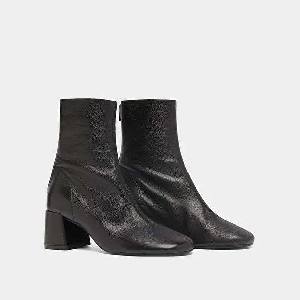 Ankle boots with rear zips in black grained leather