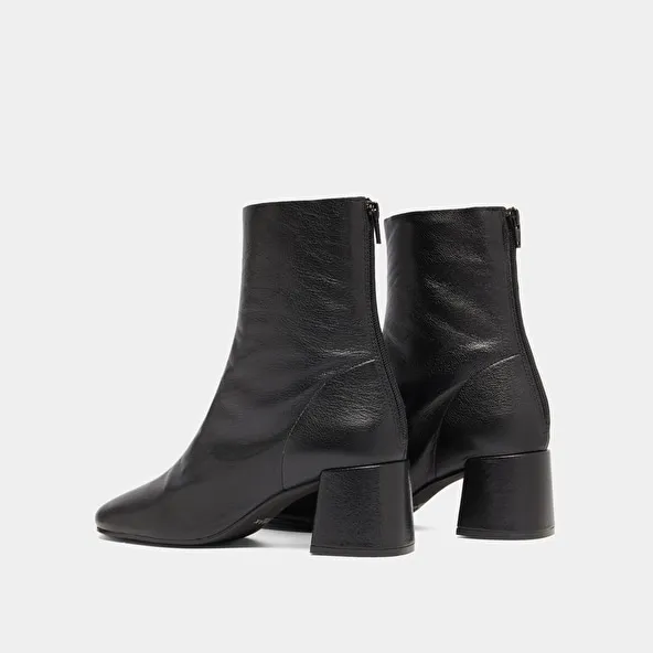 Ankle boots with rear zips in black grained leather