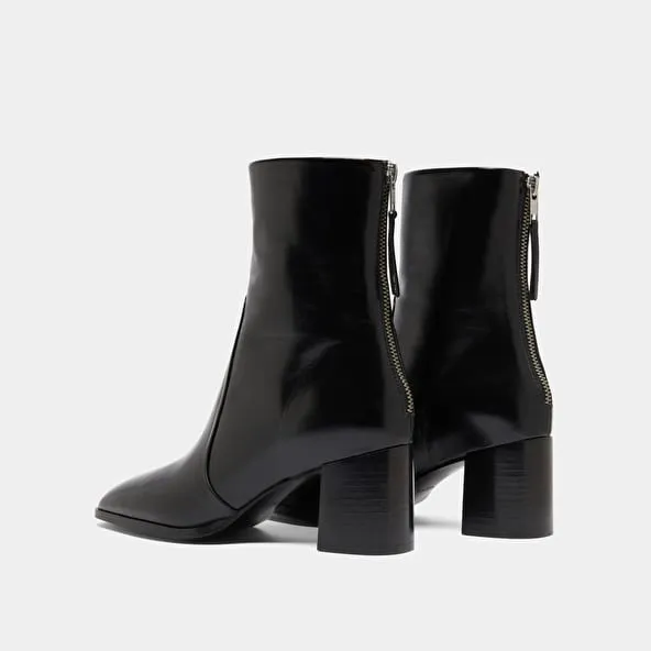 Ankle boots with rear zips in black leather